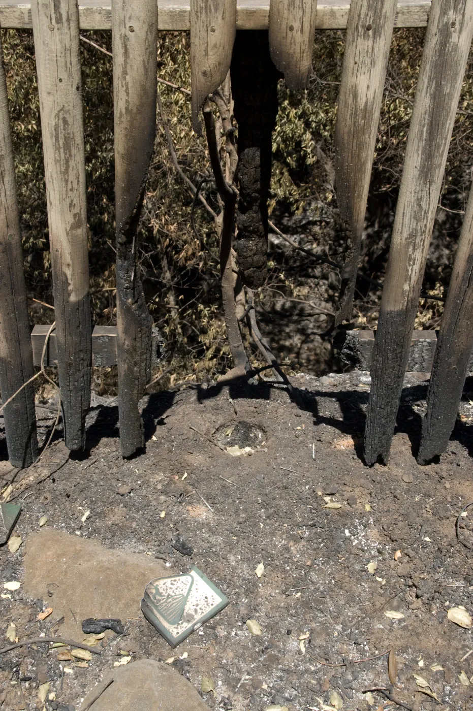 burned fence above drop-off to Mission Dam after the Jesusita Fire