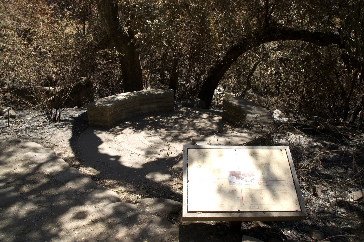Spiral patio and circular stone bench in the Fiber Arts Display after the Jesusita Fire