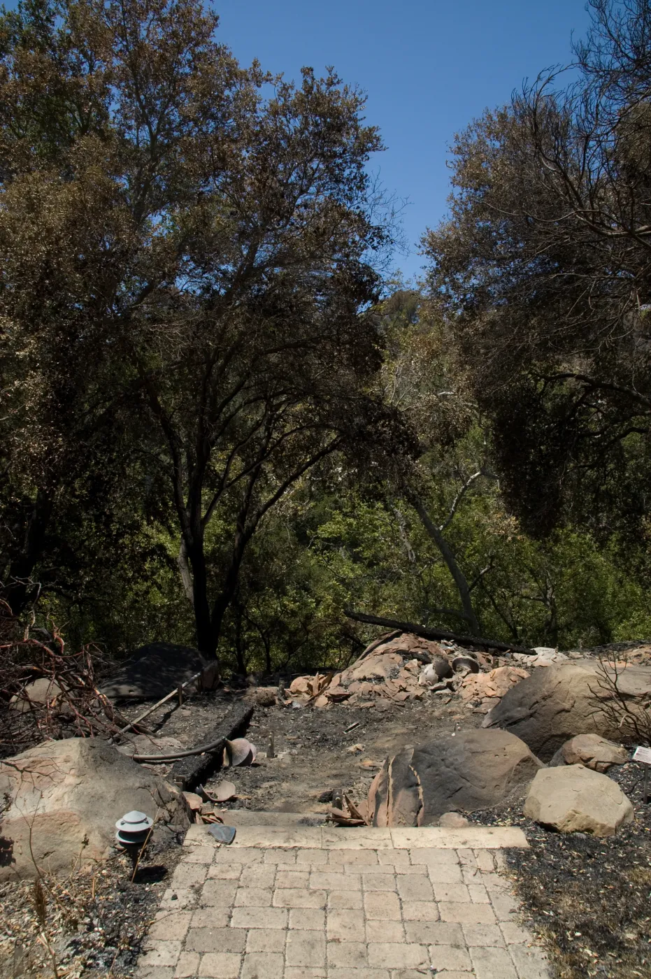 burned wood deck along canyon rim after the Jesusita Fire