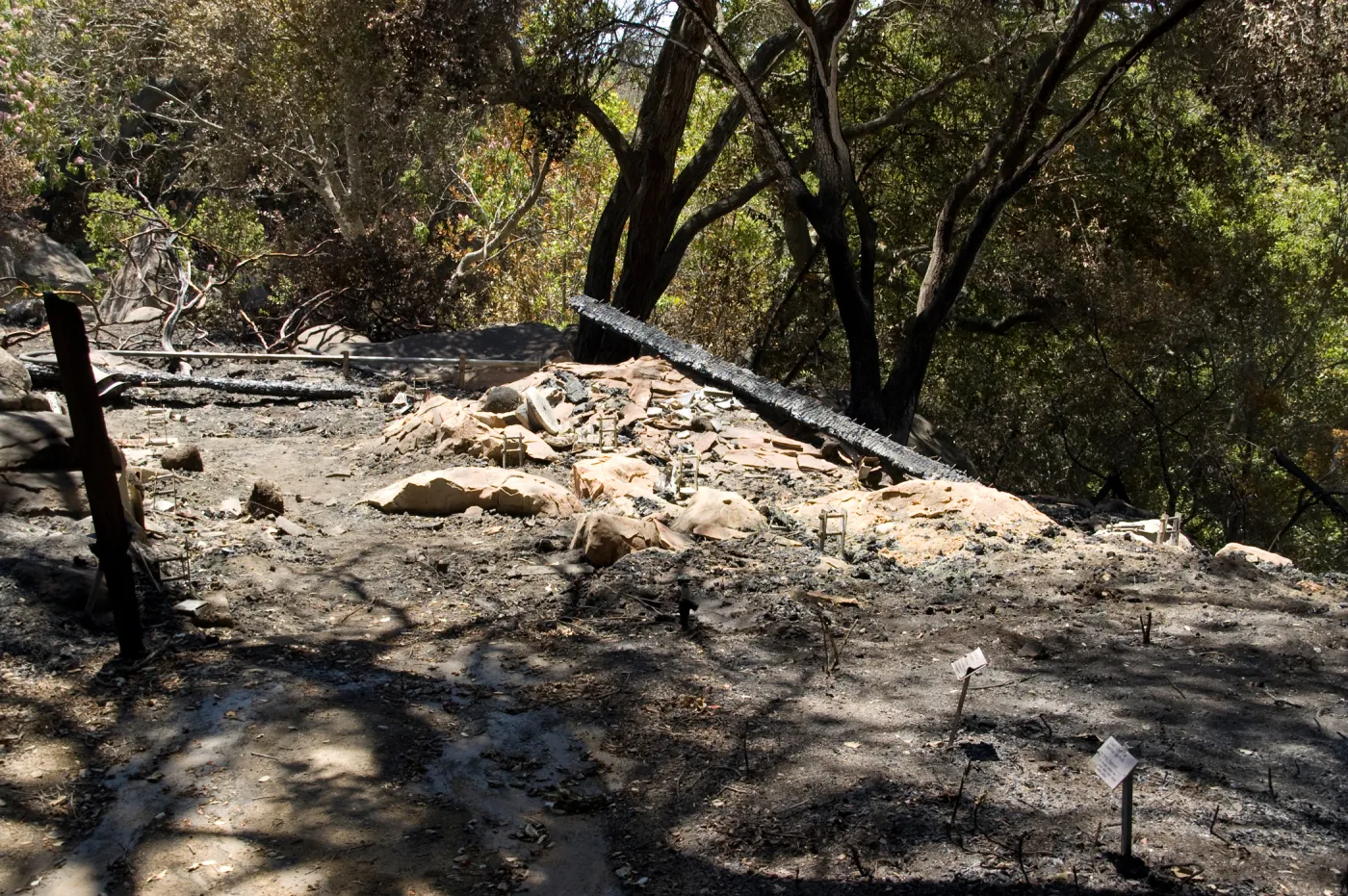 burned remains of the Home Demonstration deck, adjacent to the cottage, after the Jesusita Fire