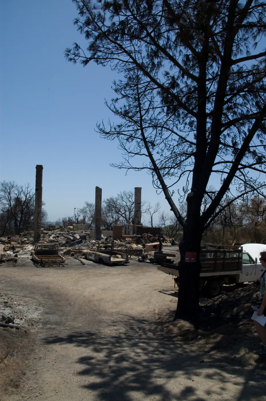 burned vehicles parked at the Gane House site, after the Jesusita Fire