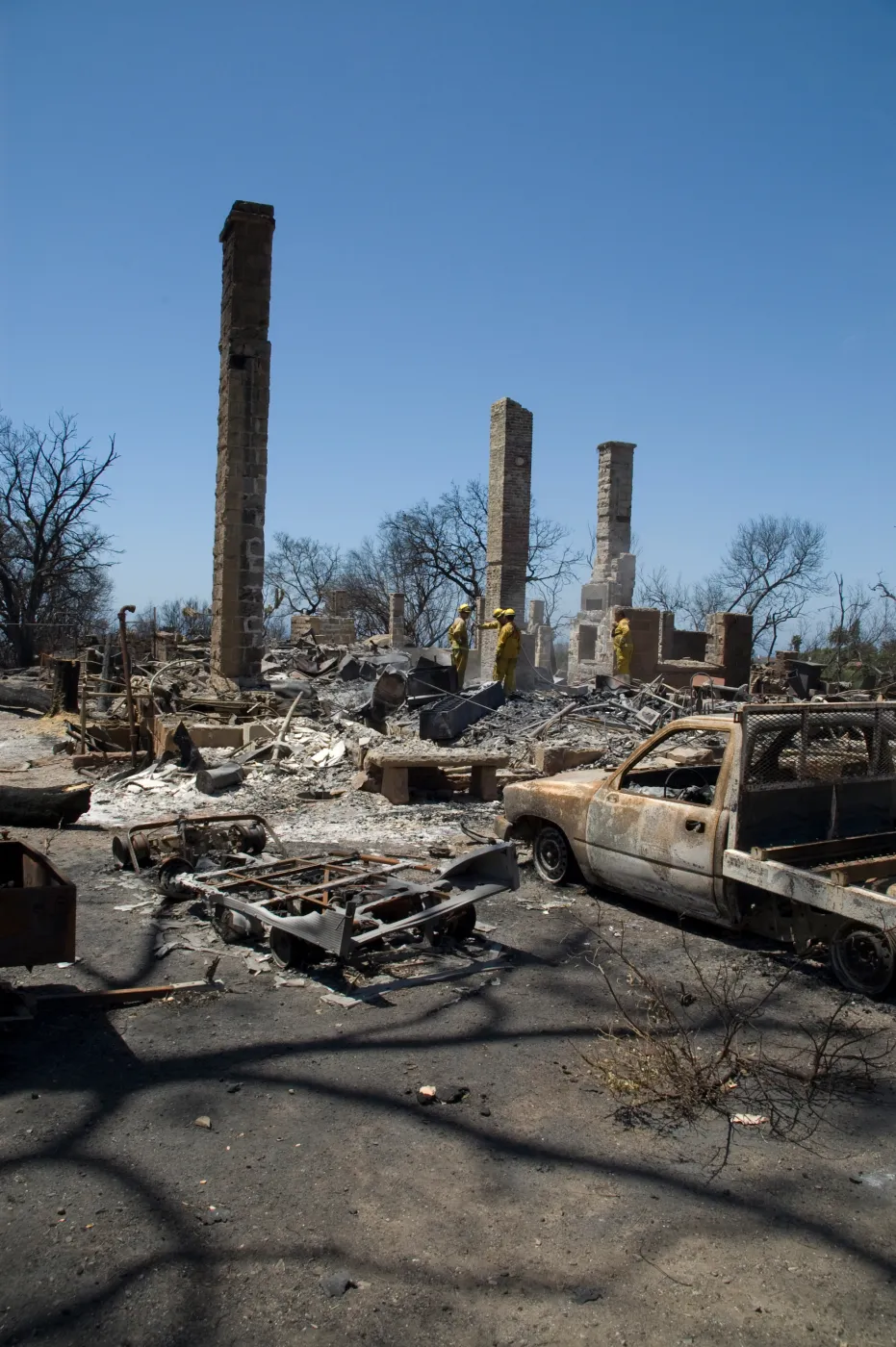 firefighters put out a hot spot at the Gane House site, after the Jesusita Fire
