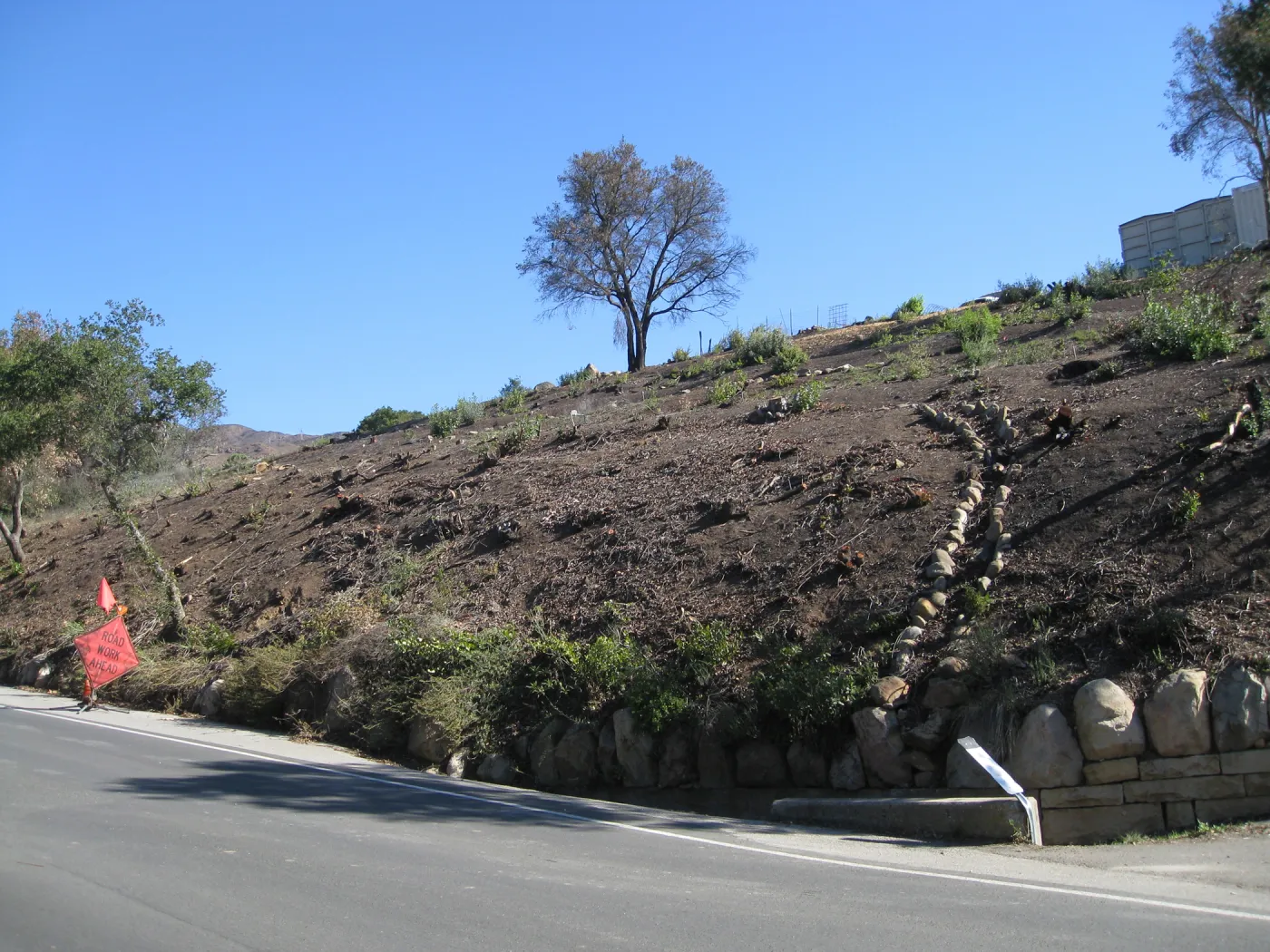 Drainage canal exposed by fire clearing, Mission Canyon Rd