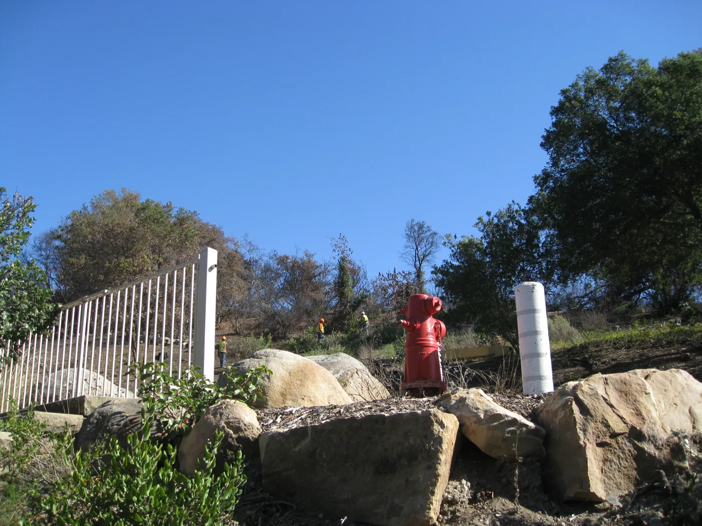 Watching the work crew from inside the parking lot