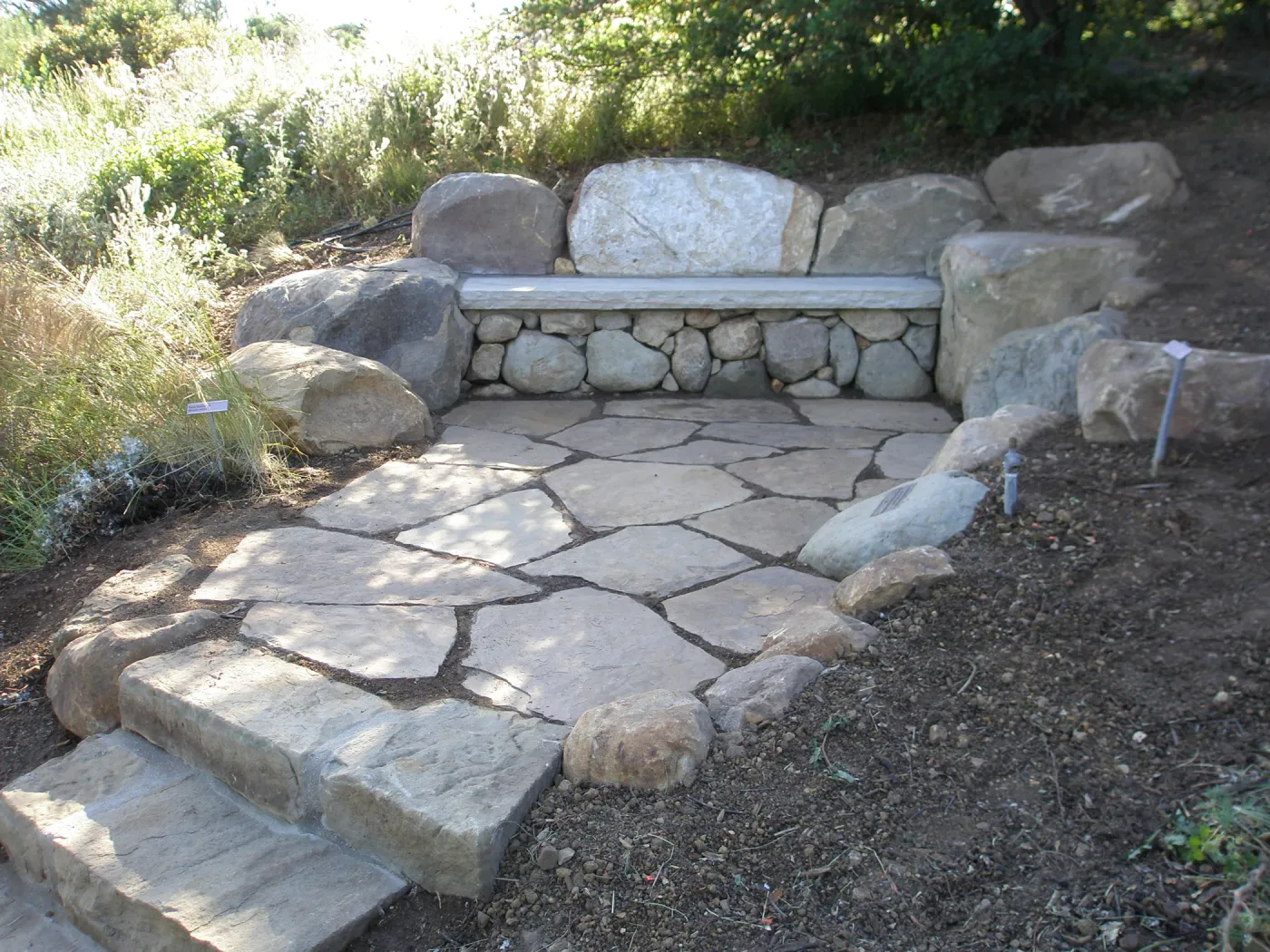Connor Bench. Stone bench and steps on Porter Trail, site of old Wheeler Bench