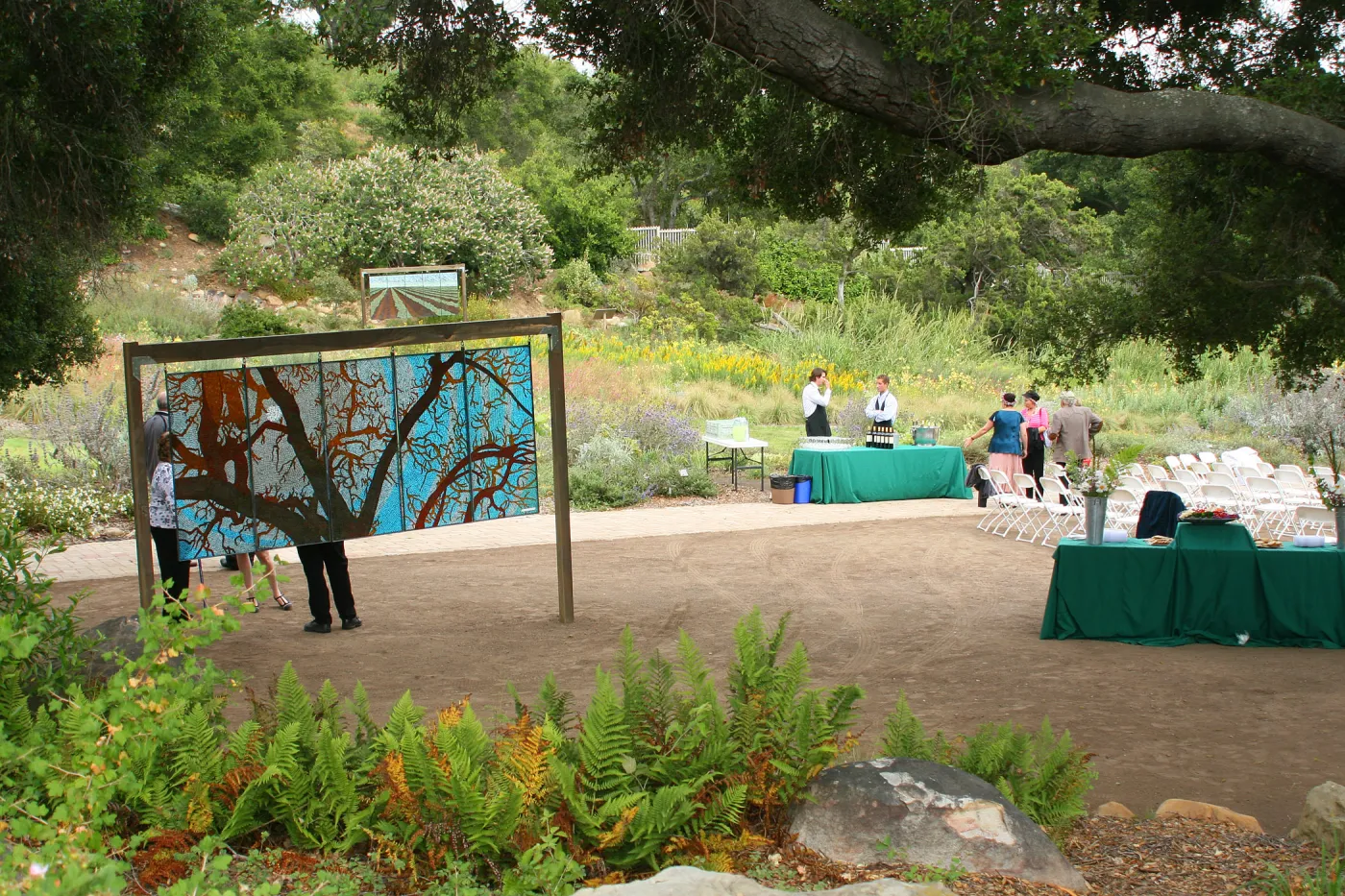 stained glass art exhibit, under the Meadow Oaks. Rose and Nightingale concert in the Garden event