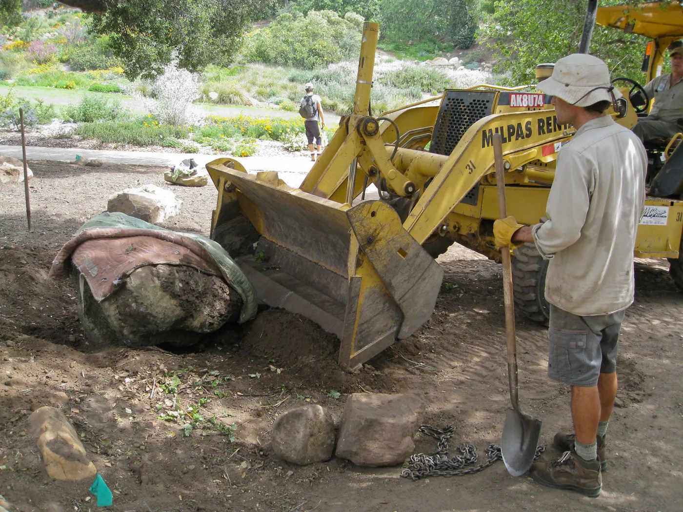Moving boulders for bed on north side of Meadow Oaks