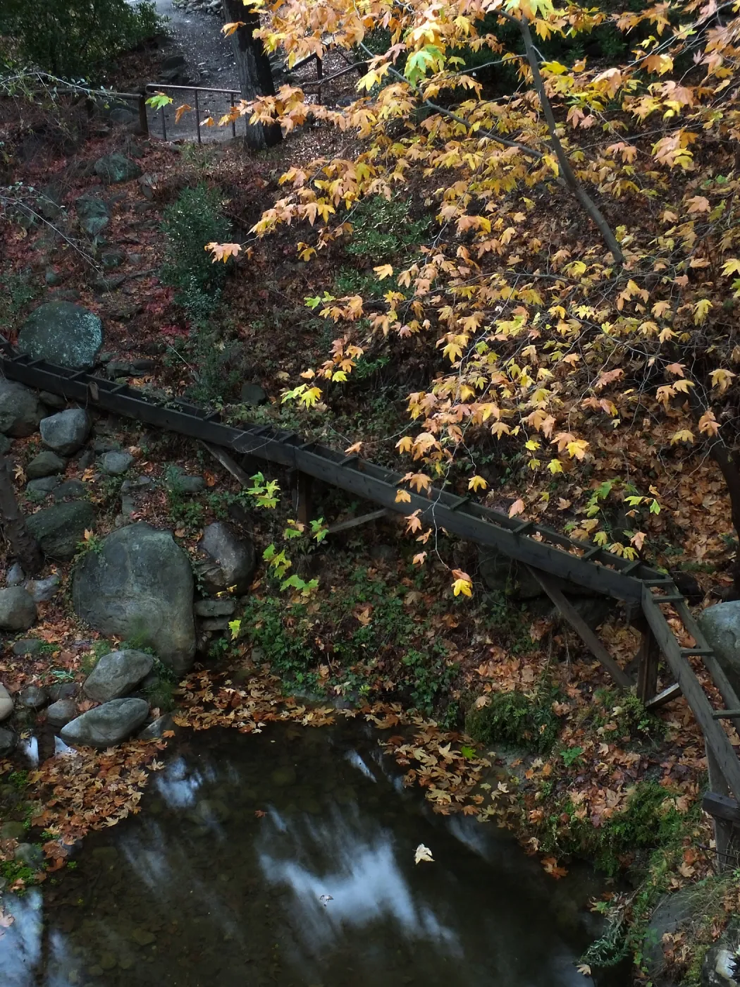Mission Aqueduct and pool below Mission Dam after rain
