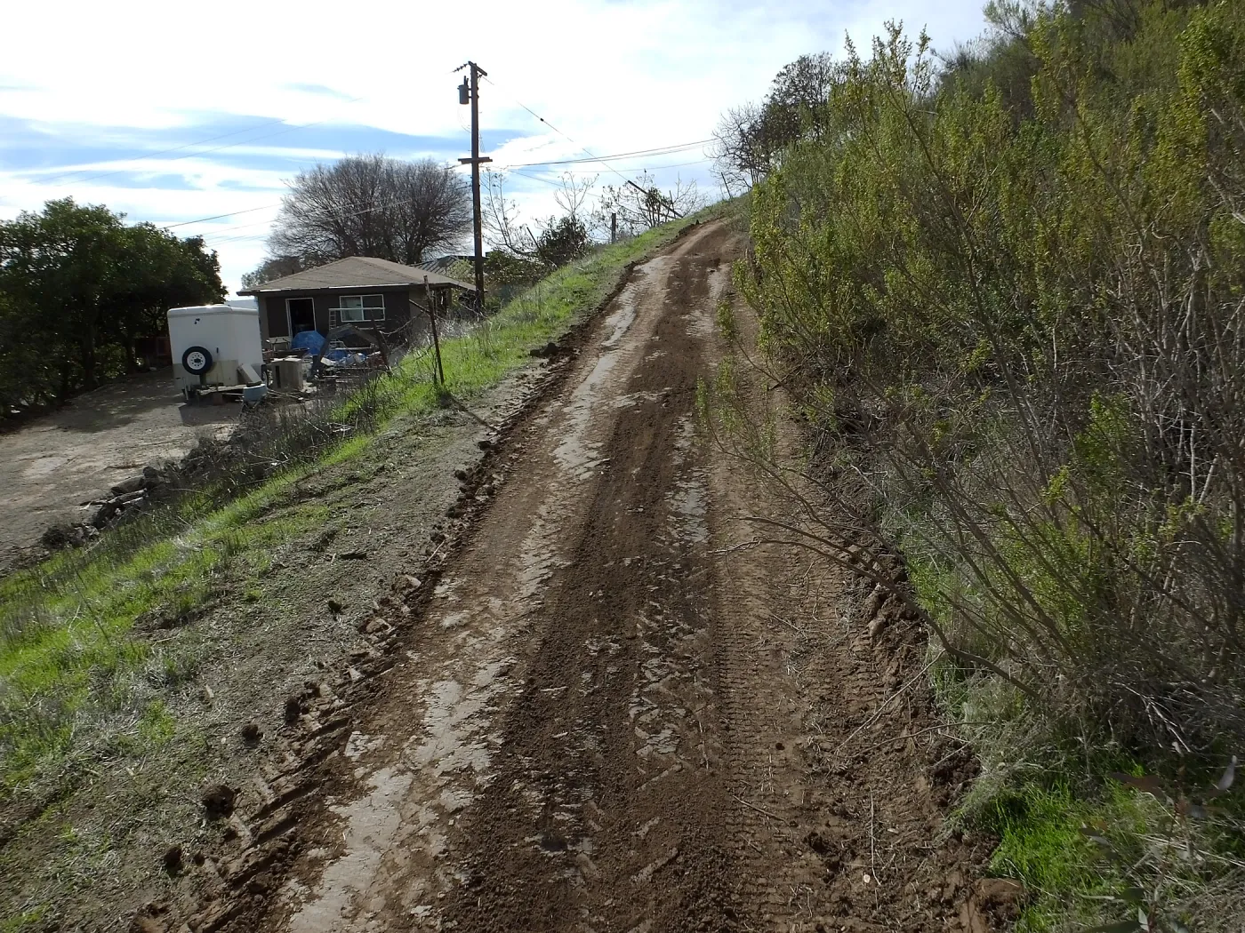 Road grading at Cavelli property to control soil erosion into neighboring property
