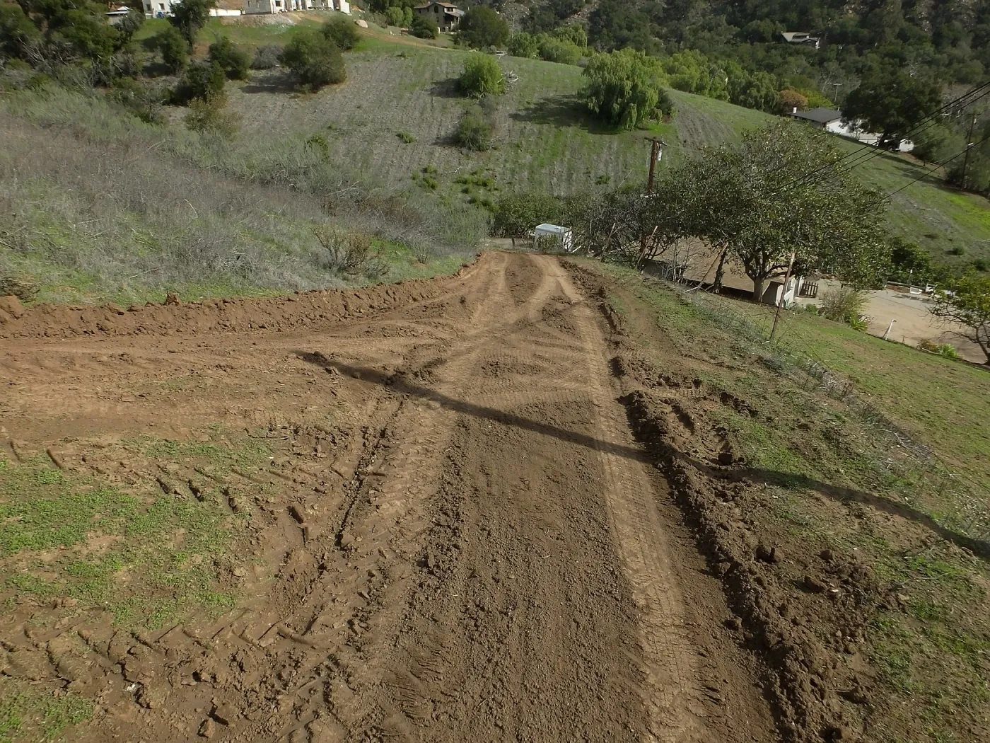 Road grading at Cavelli property to control soil erosion into neighboring property