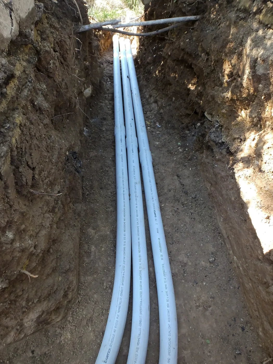 Power and data conduit being installed in the Arroyo Section
