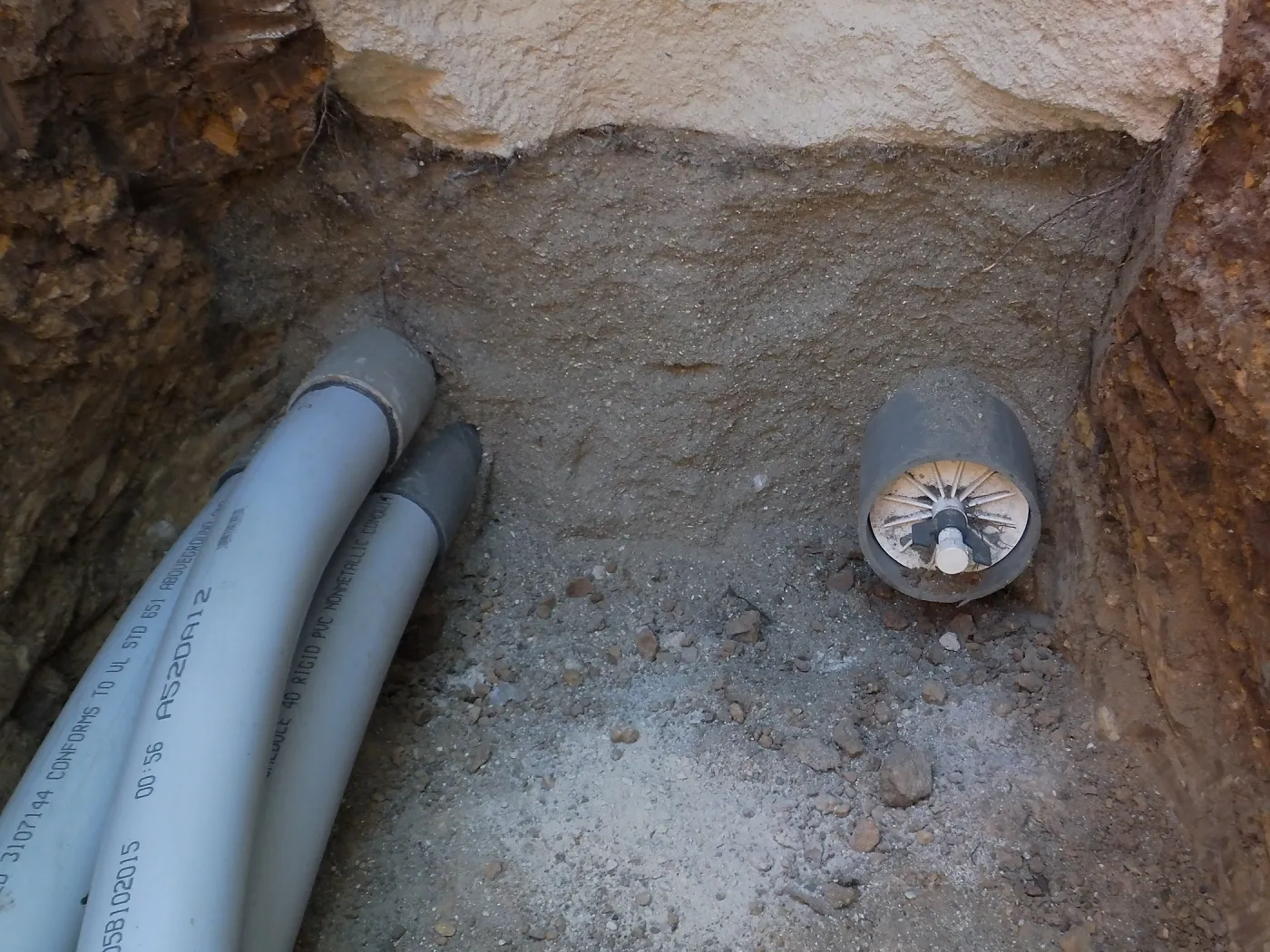 Power and data conduit being installed in the Arroyo Section