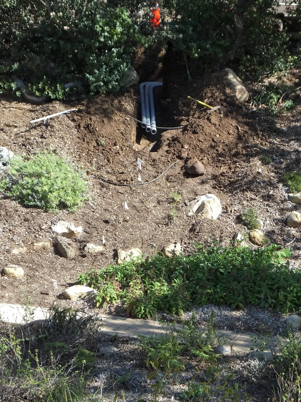 Power and data conduit being installed in the Arroyo Section