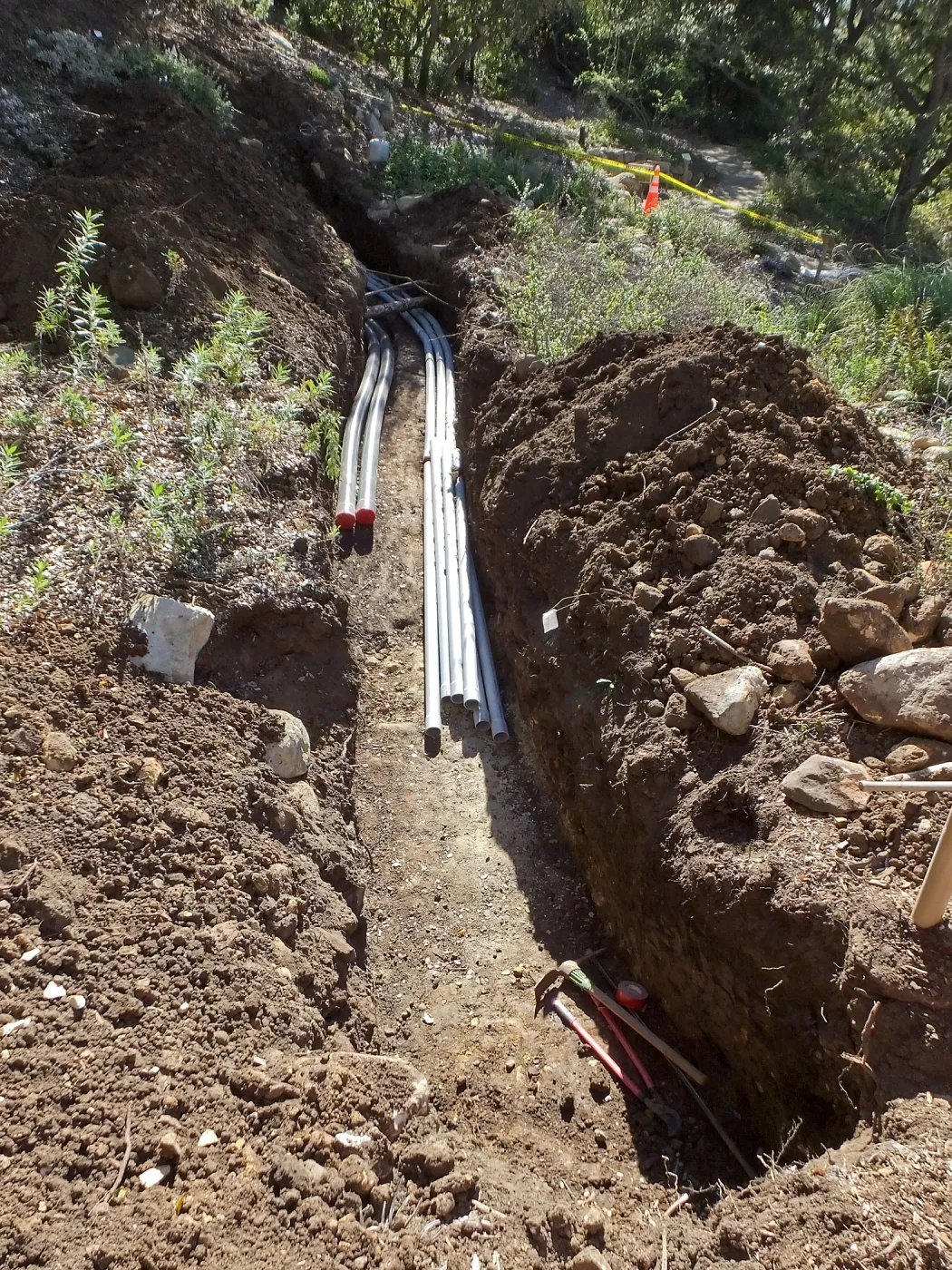 Power and data conduit being installed in the Arroyo Section