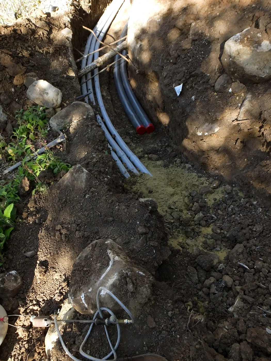 Power and data conduit being installed in the Arroyo Section