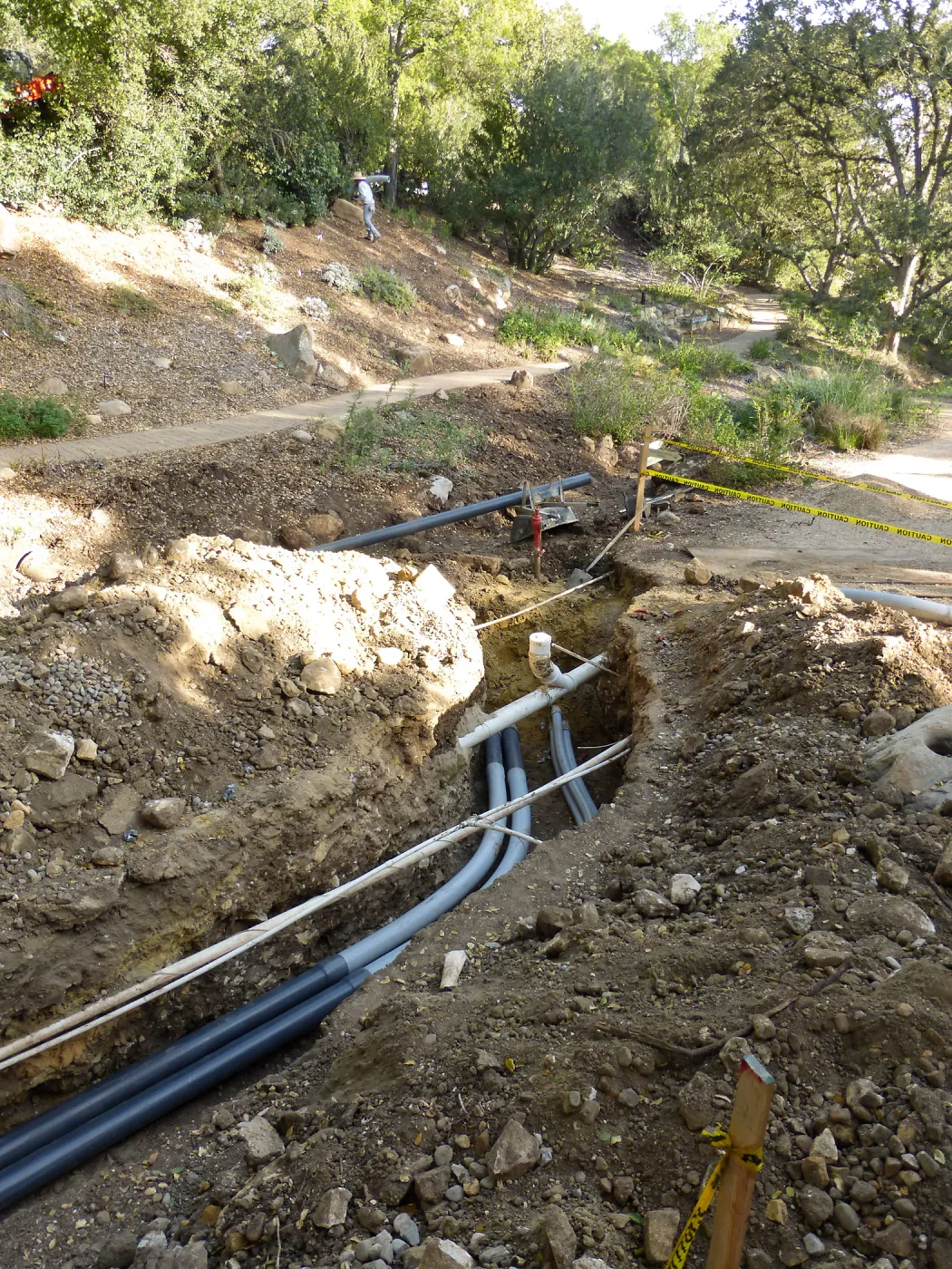 Power and data conduit being installed in the Arroyo Section