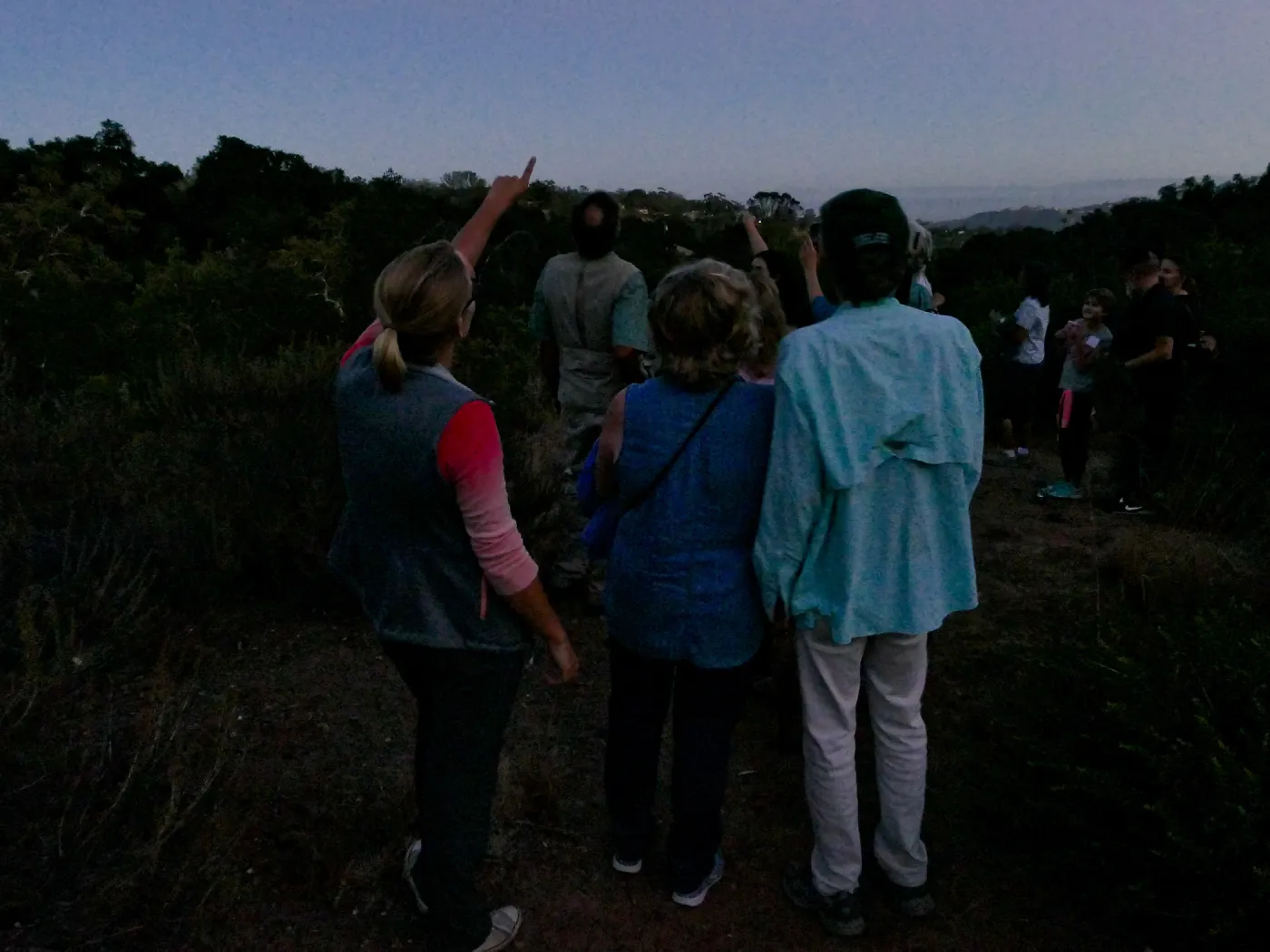 Member Appreciation Month, Full Moon Hike, hikers observing the sky at top of Pritchett Trail