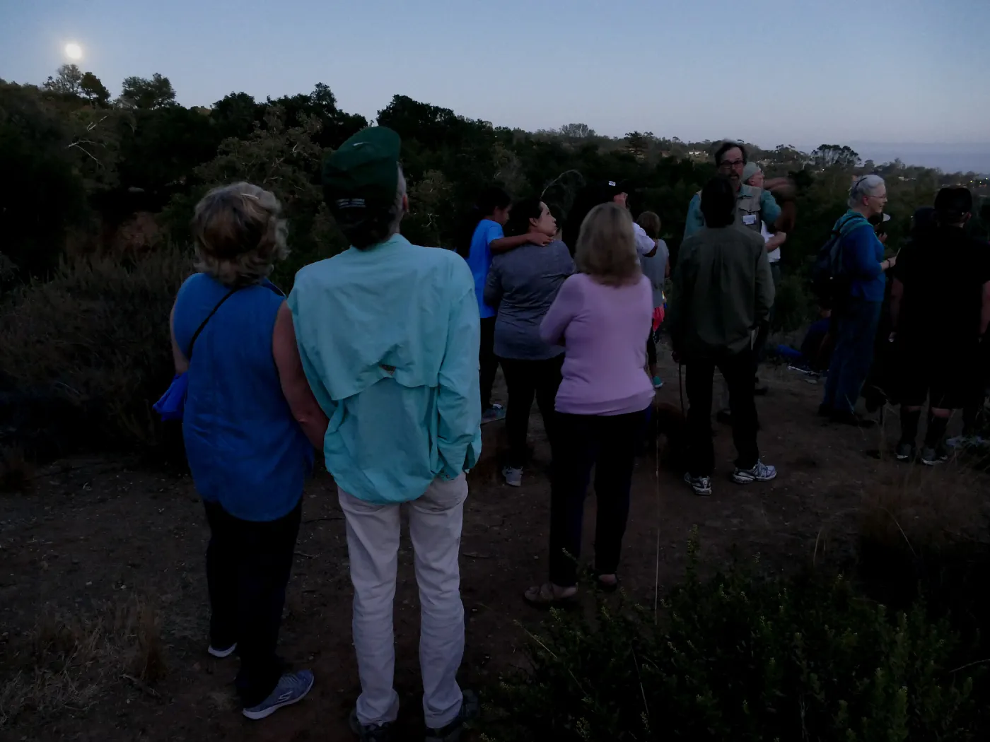 Member Appreciation Month, Full Moon Hike, hikers observing the sky at top of Pritchett Trail