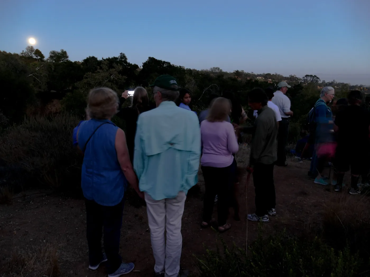 Member Appreciation Month, Full Moon Hike, hikers observing the sky at top of Pritchett Trail