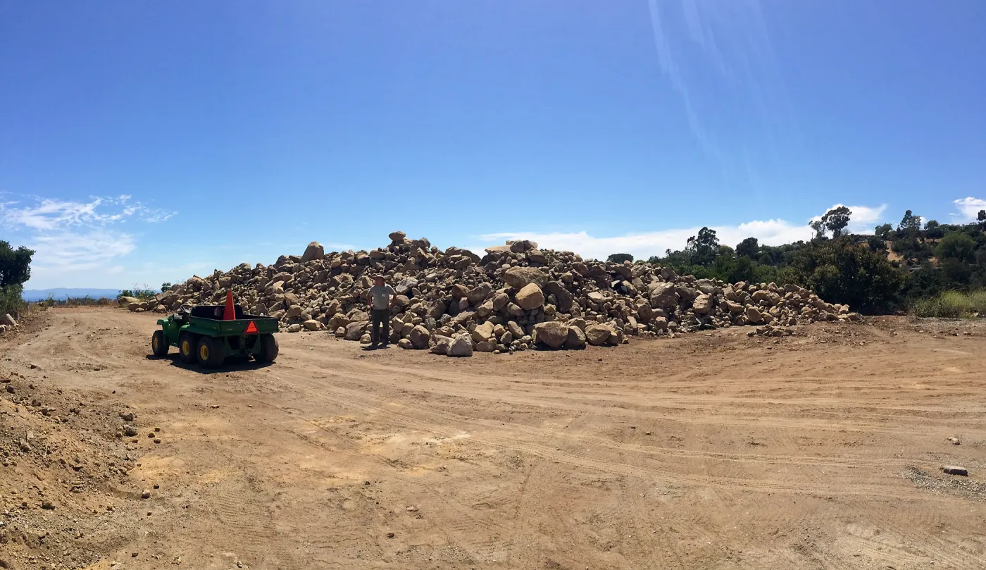 Rock pile at Gane House site, with Dave Kershaw