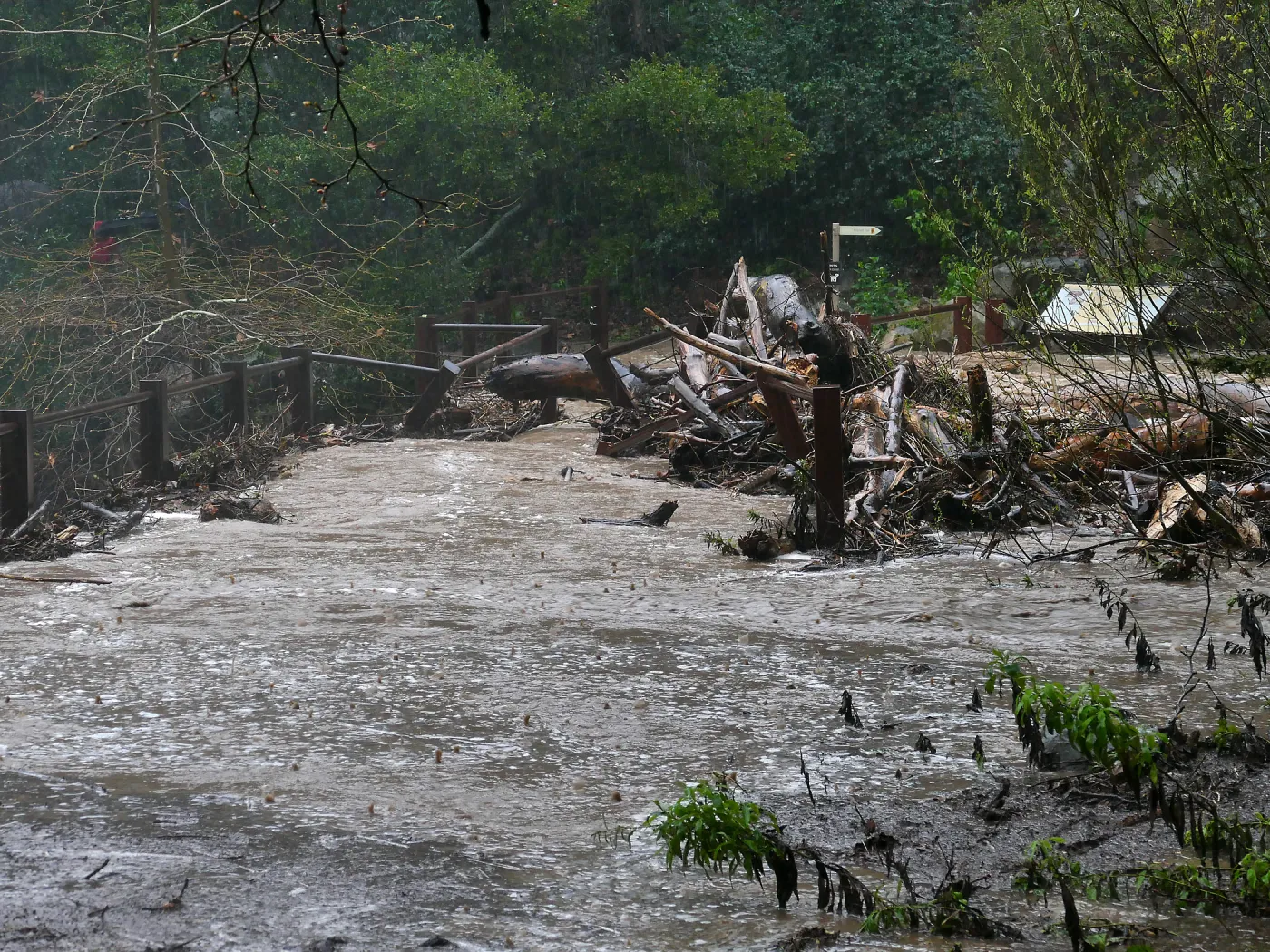 Debris accumulation at Mission Dam during rainstorm