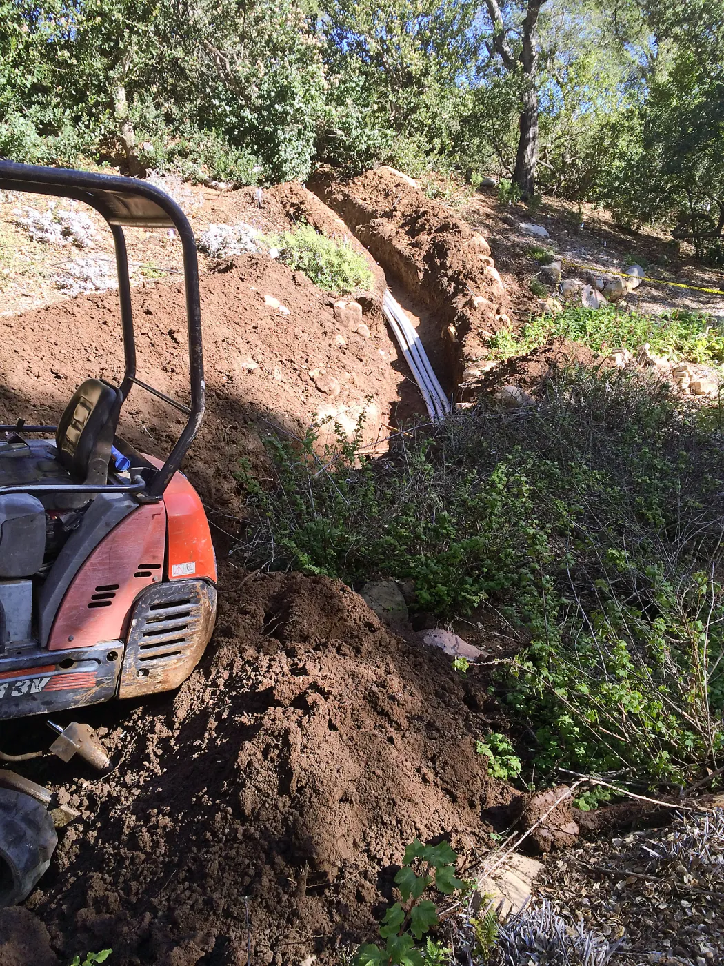 Power and data conduit being installed in the Arroyo Section