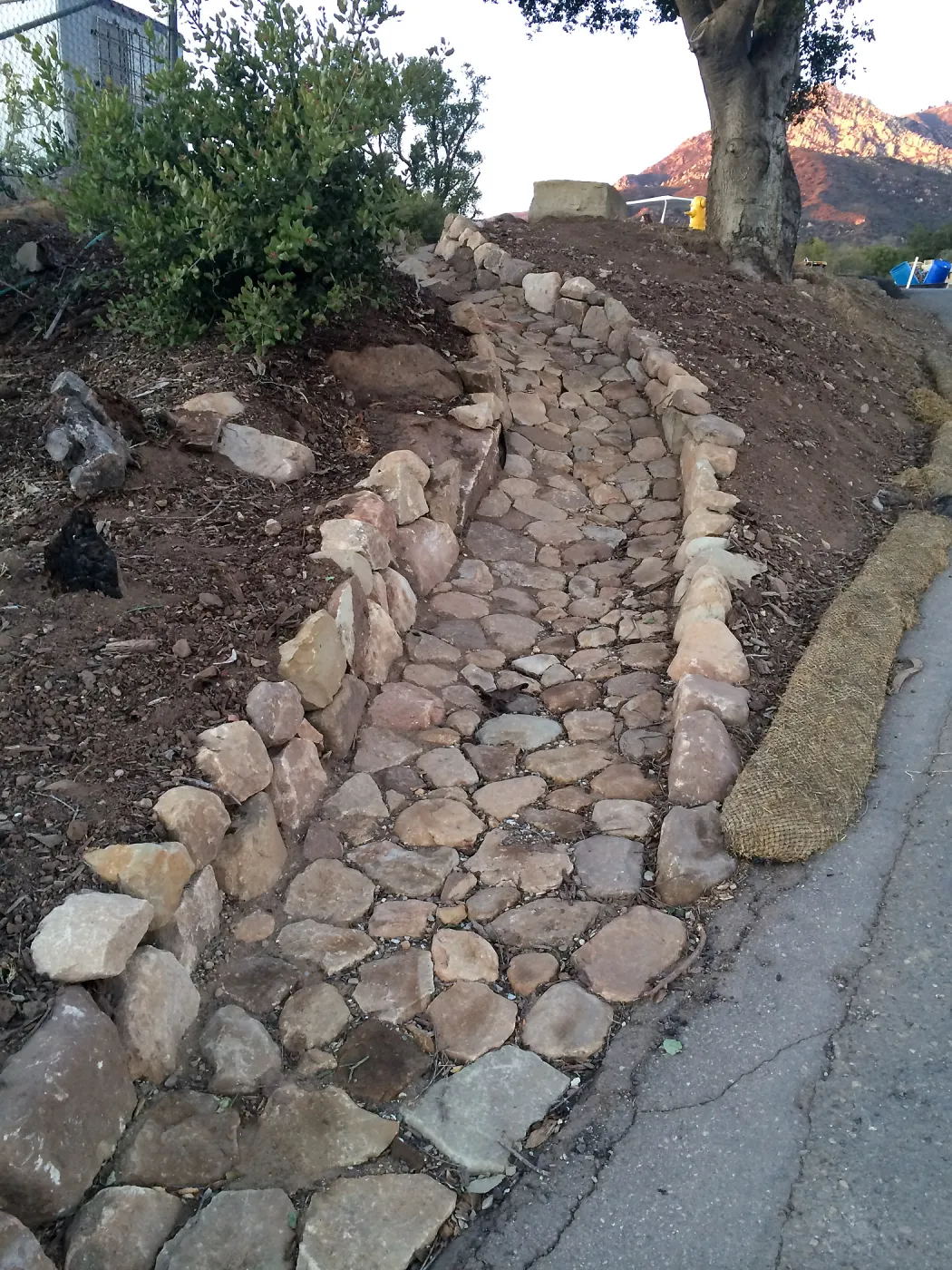 Completed drainage culvert southeast corner of upper parking lot.