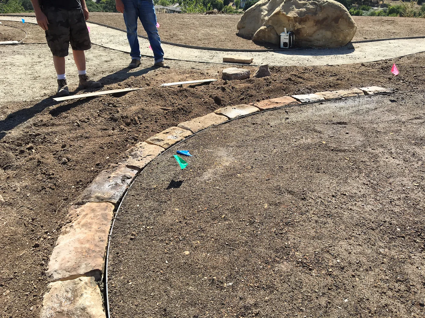 Construction of stone edging in Island View Garden lawn
