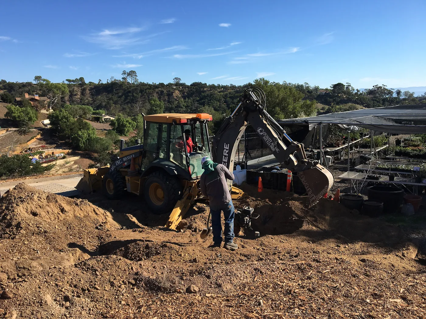 Putting in new electrical line to Horticulture Head House