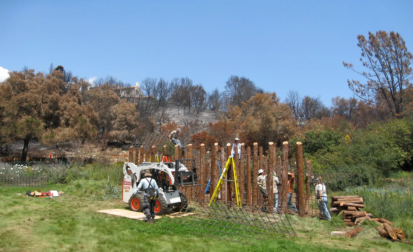 Construction of Herb Parker's â€˜Haven' labyrinth, placing roof structure