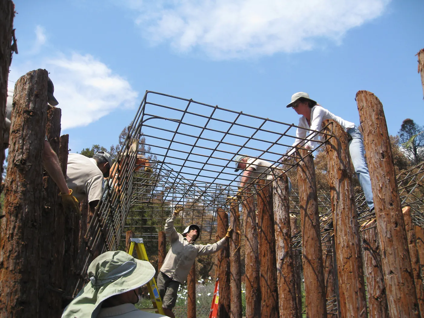 Construction of Herb Parker's â€˜Haven' labyrinth, placing roof structure
