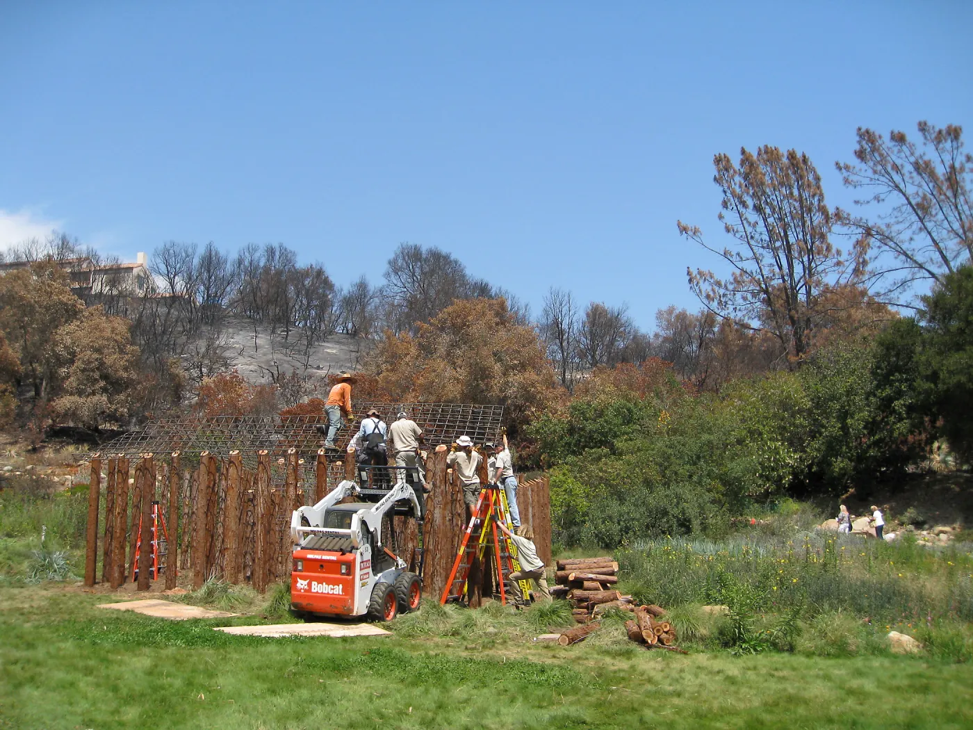 Construction of Herb Parker's â€˜Haven' labyrinth, placing roof structure