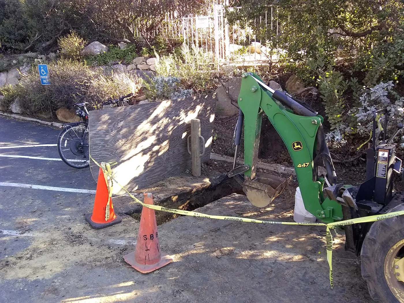 Irrigation water line repair in main parking lot, just south of the bike rack, looking northeast