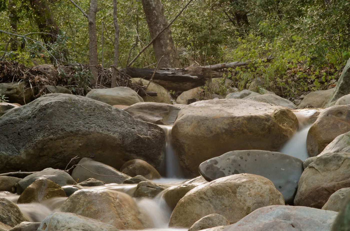 Water flowing over the rocks of the lower creek crossing. 