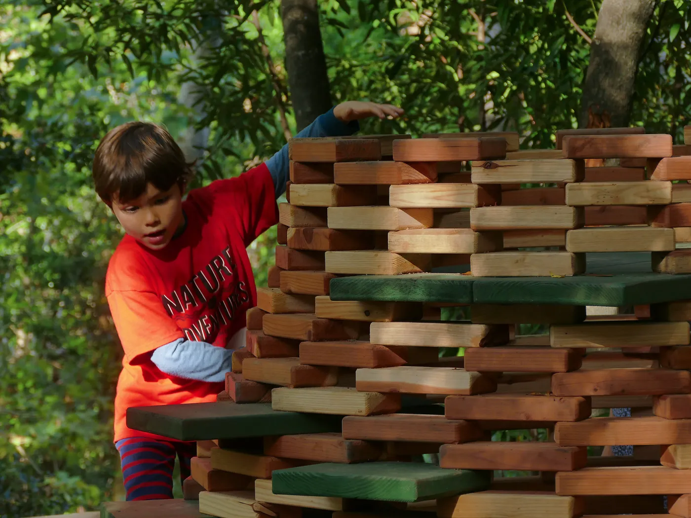 Santa Barbara Botanic Garden Casitas Opening, child playing on â€œThe Hivesâ€ Casita