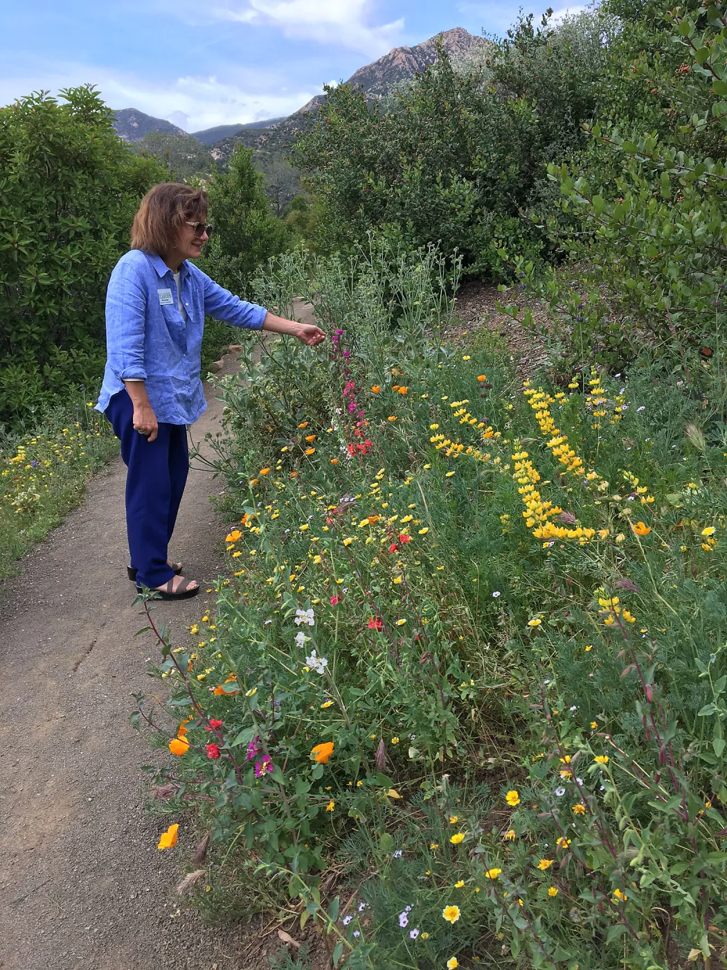 Nina Dunbar with wildflowers on Southwest Trail