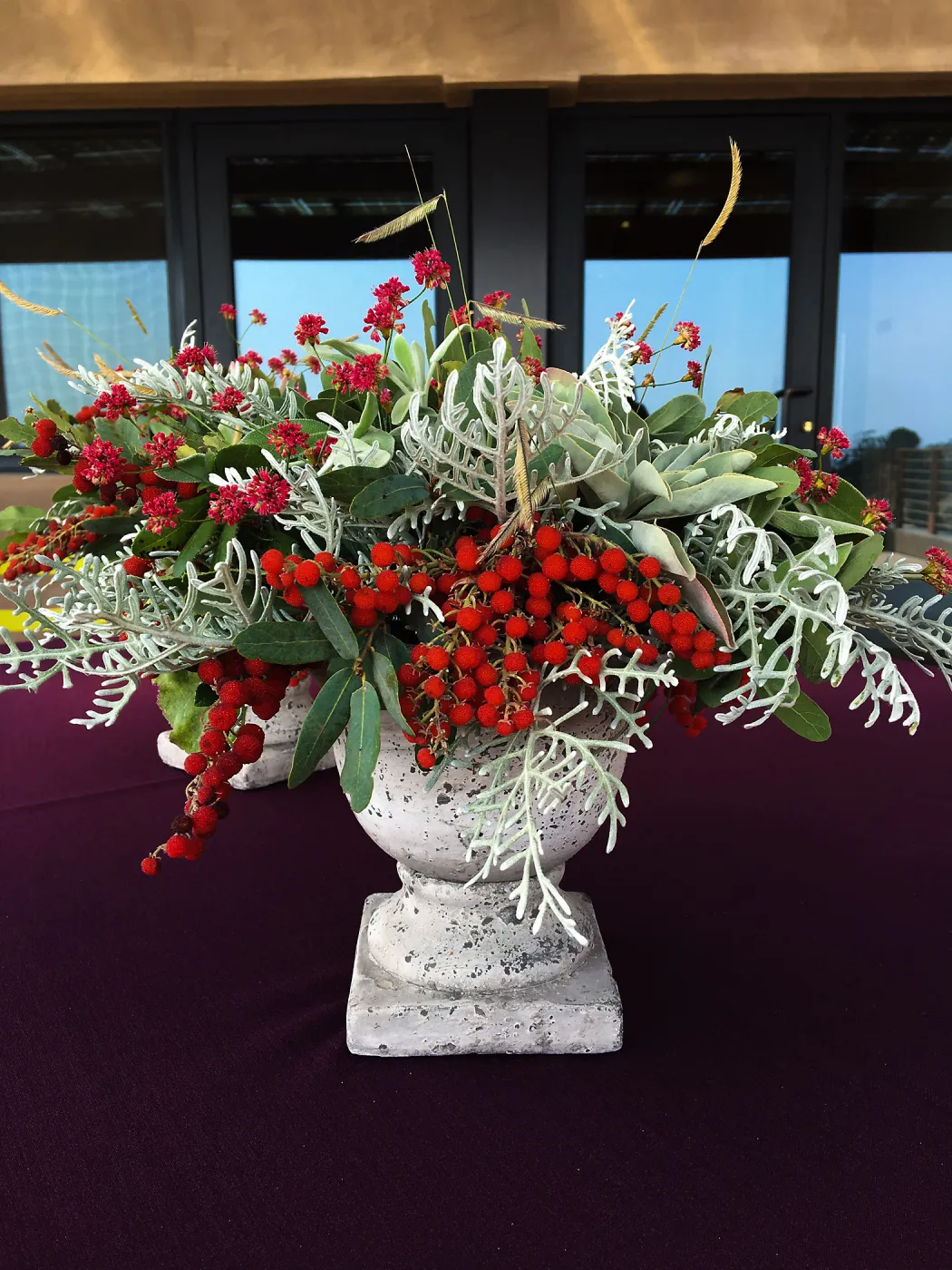 Flower arrangement with toyon berries