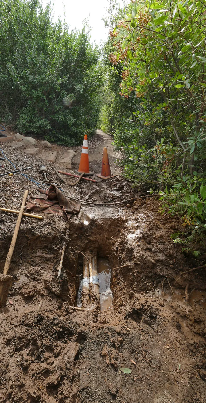 Broken 4 inch irrigation water pipe in Porter Trail section, looking south