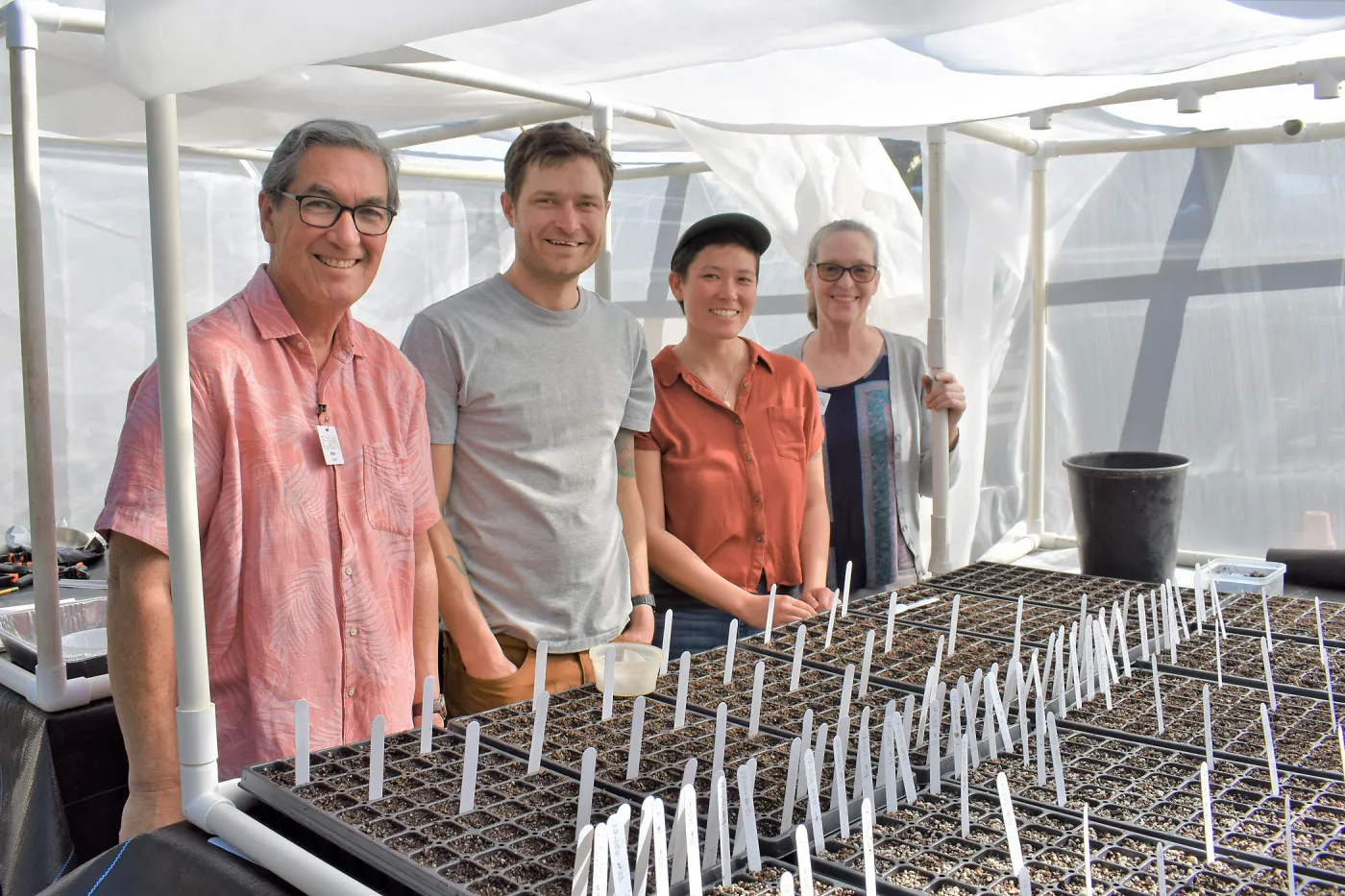 Sean Carson and volunteers working on the clarkia greenhouse project.