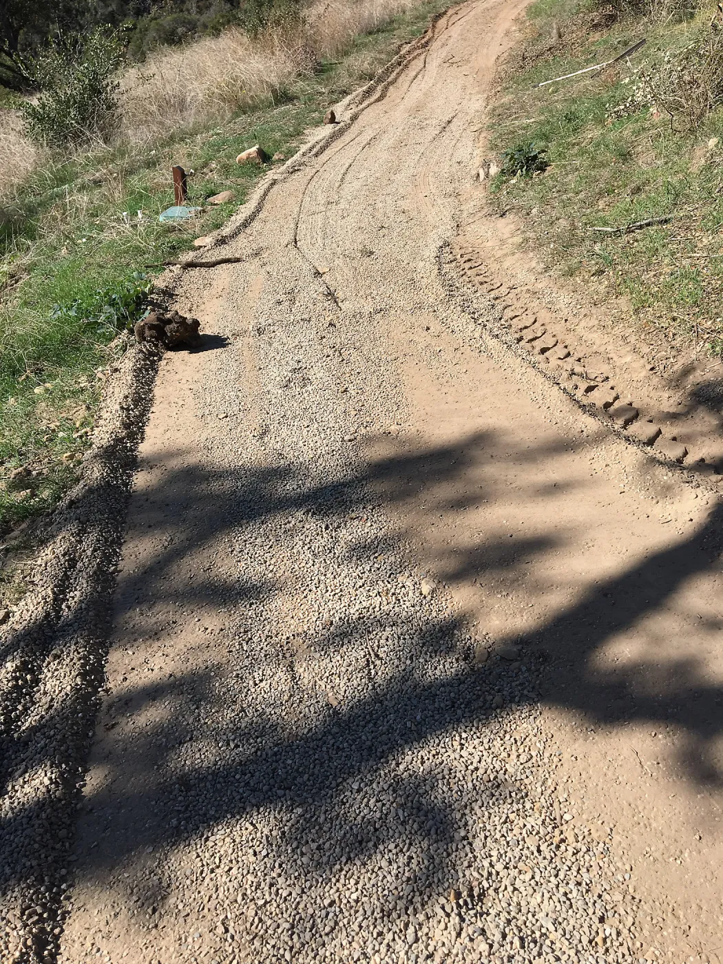 Gravel treatment to cart trail on west side of PCC