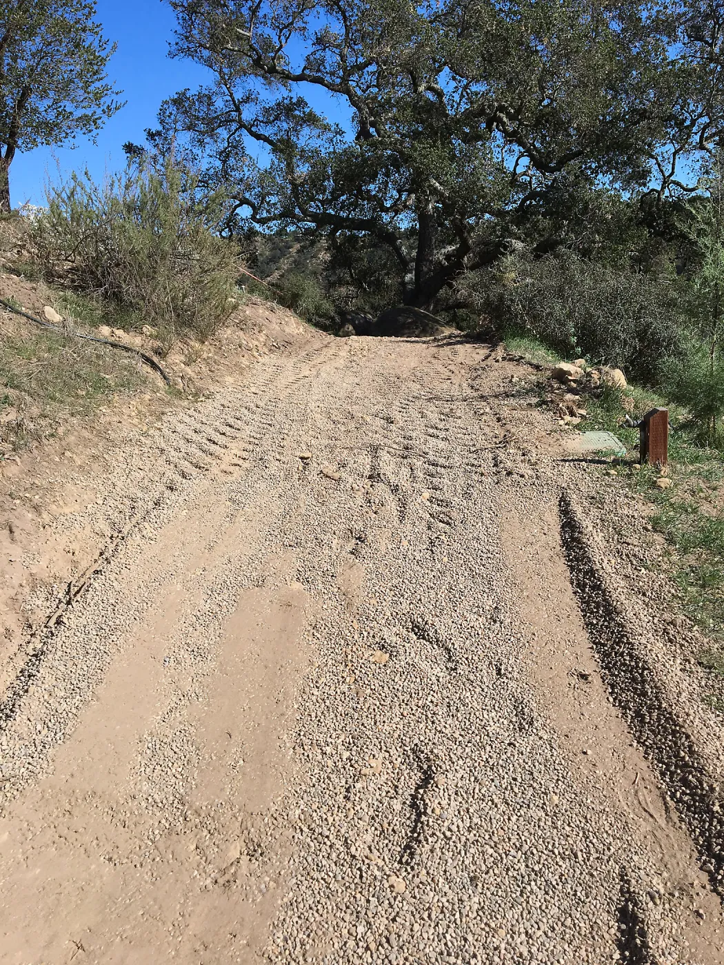 Gravel treatment to cart trail on west side of PCC