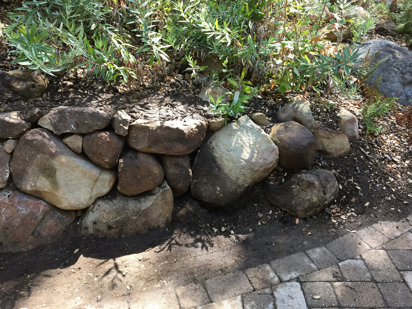 Rebuilt rock wall by Campbell Bridge
