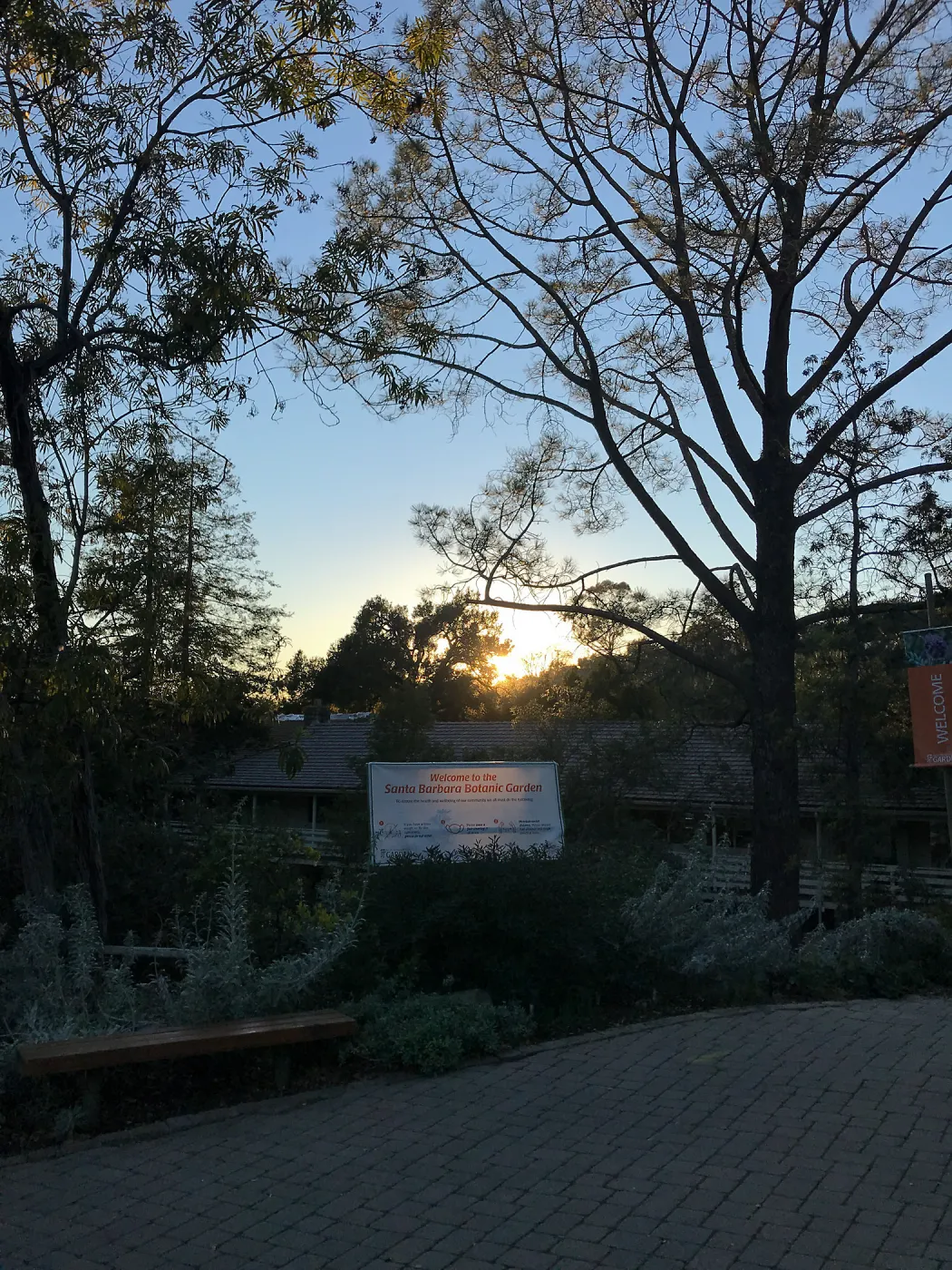 COVID-19 protocol sign at the entrance at sunset