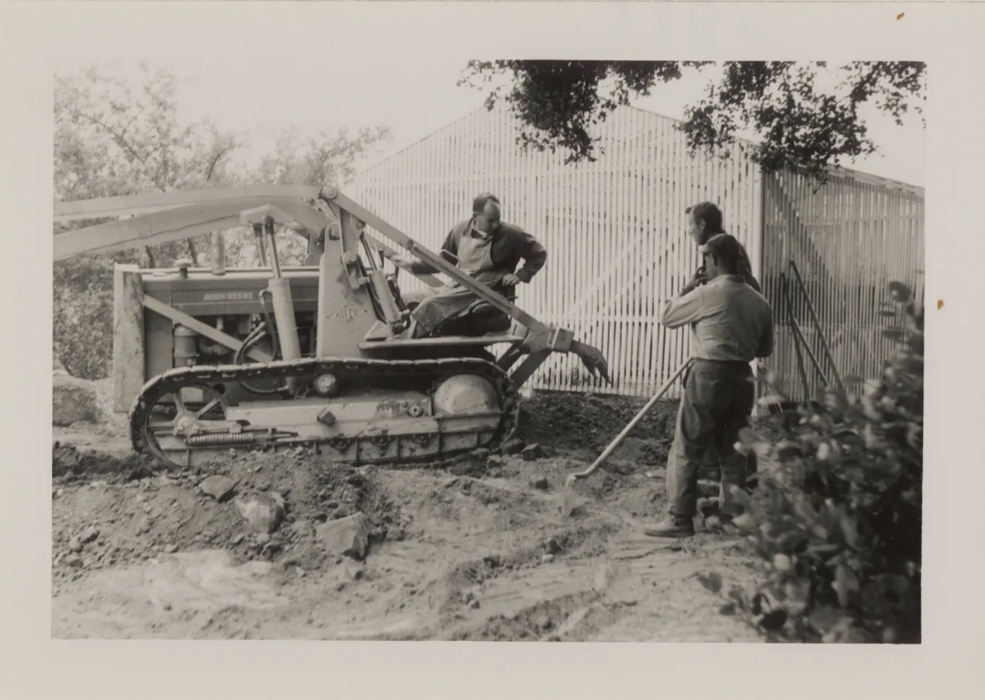 Breaking ground with tractor, Carl, Joe, Jim