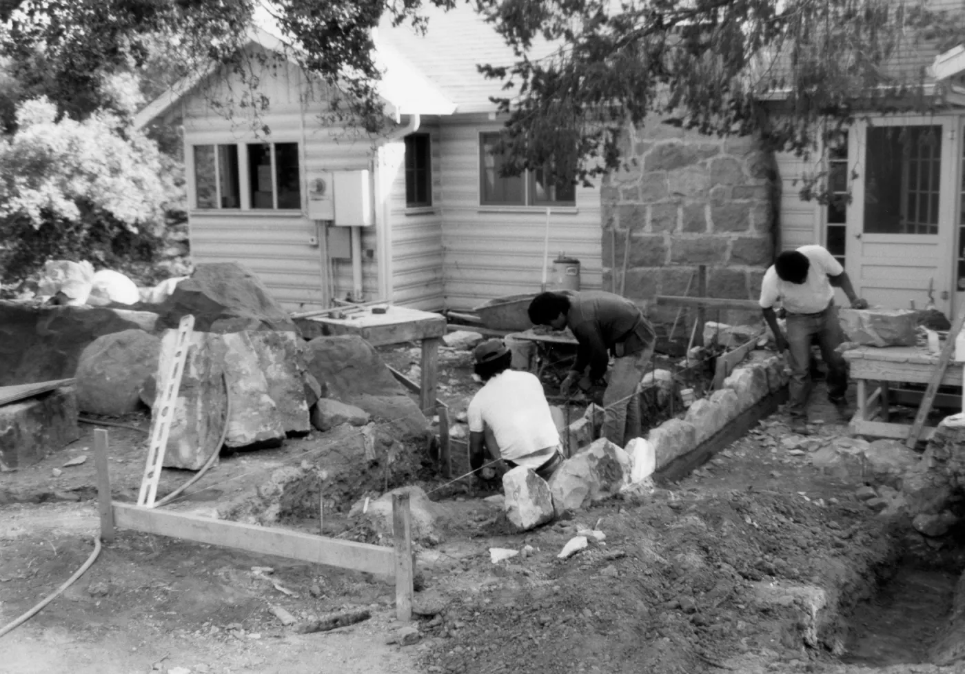 Construction of stone planters, in front of Cottage, for the Home Demonstration Garden