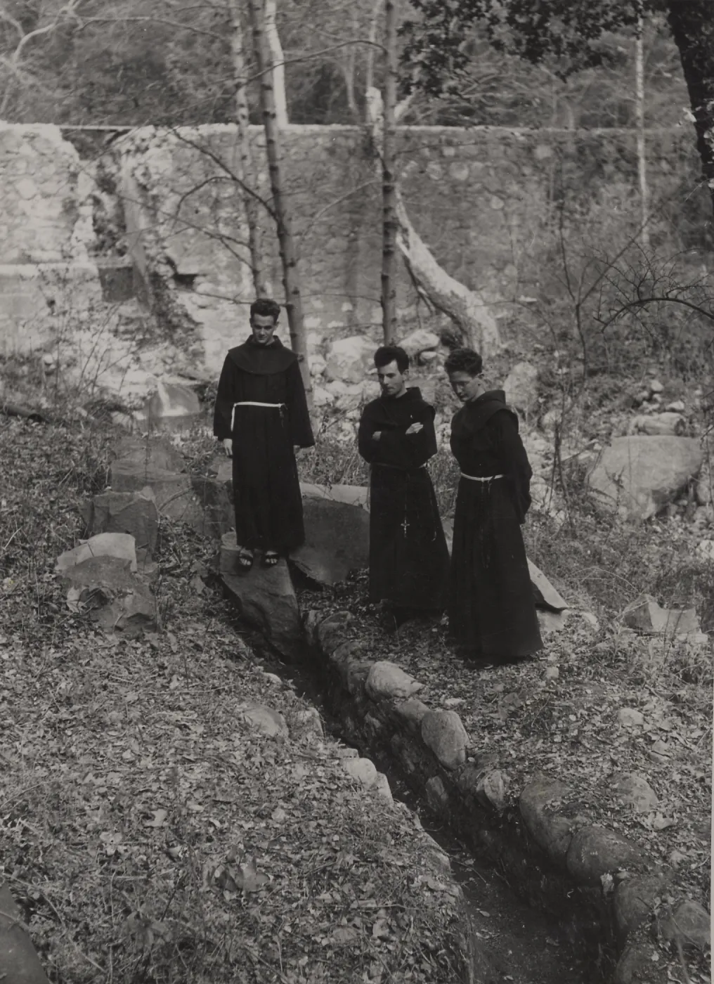 Friars (Padres) studying the ancient Aqueduct below Old Mission Dam