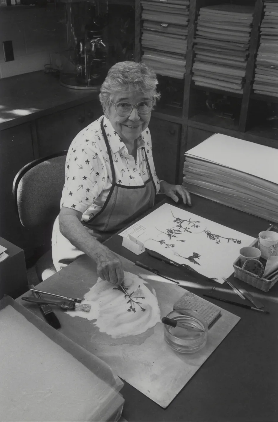 Jean Hobson mounting pressed plant specimens in the Herbarium