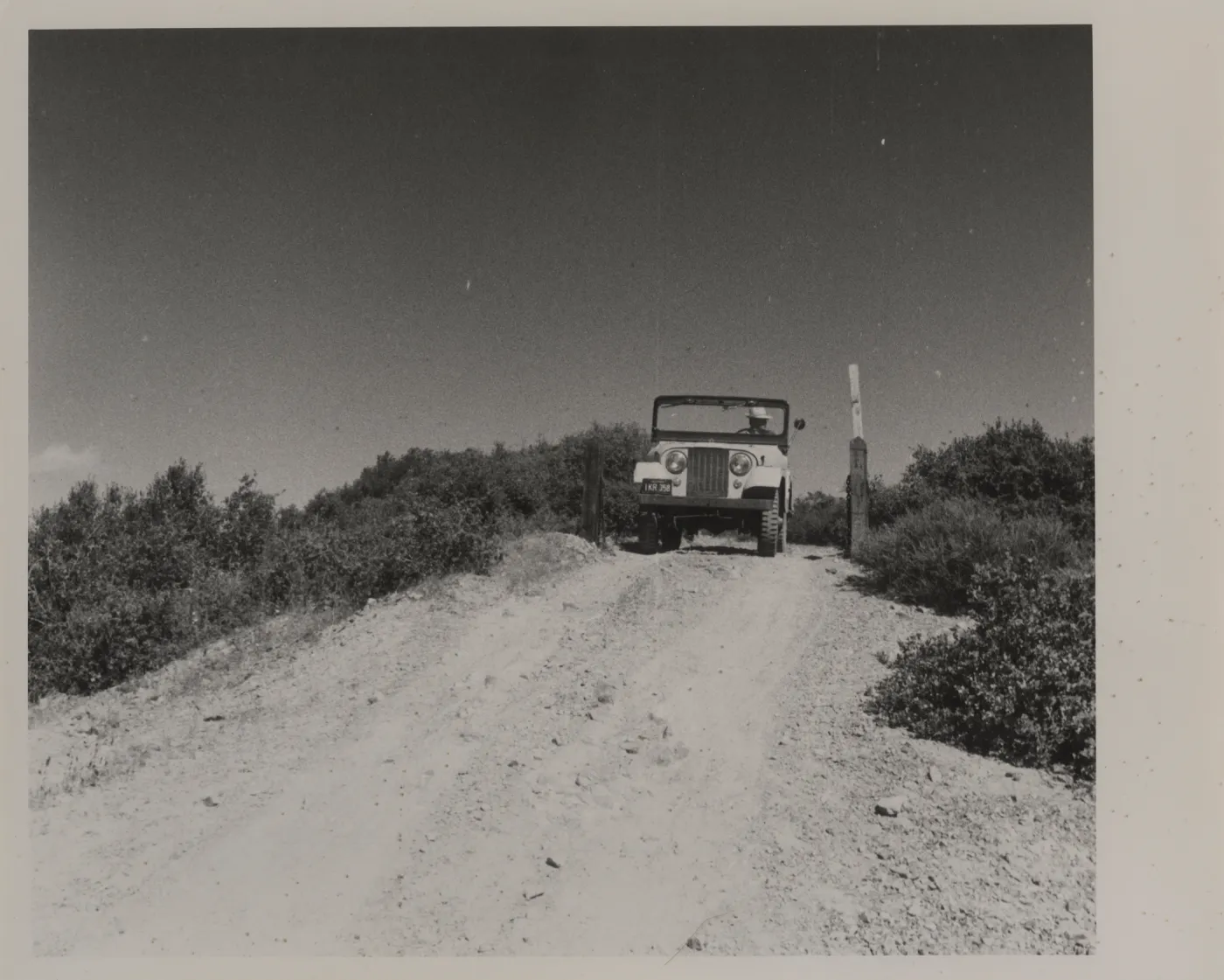 Clif Smith in jeep, Sierra Madre Road, soon after construction