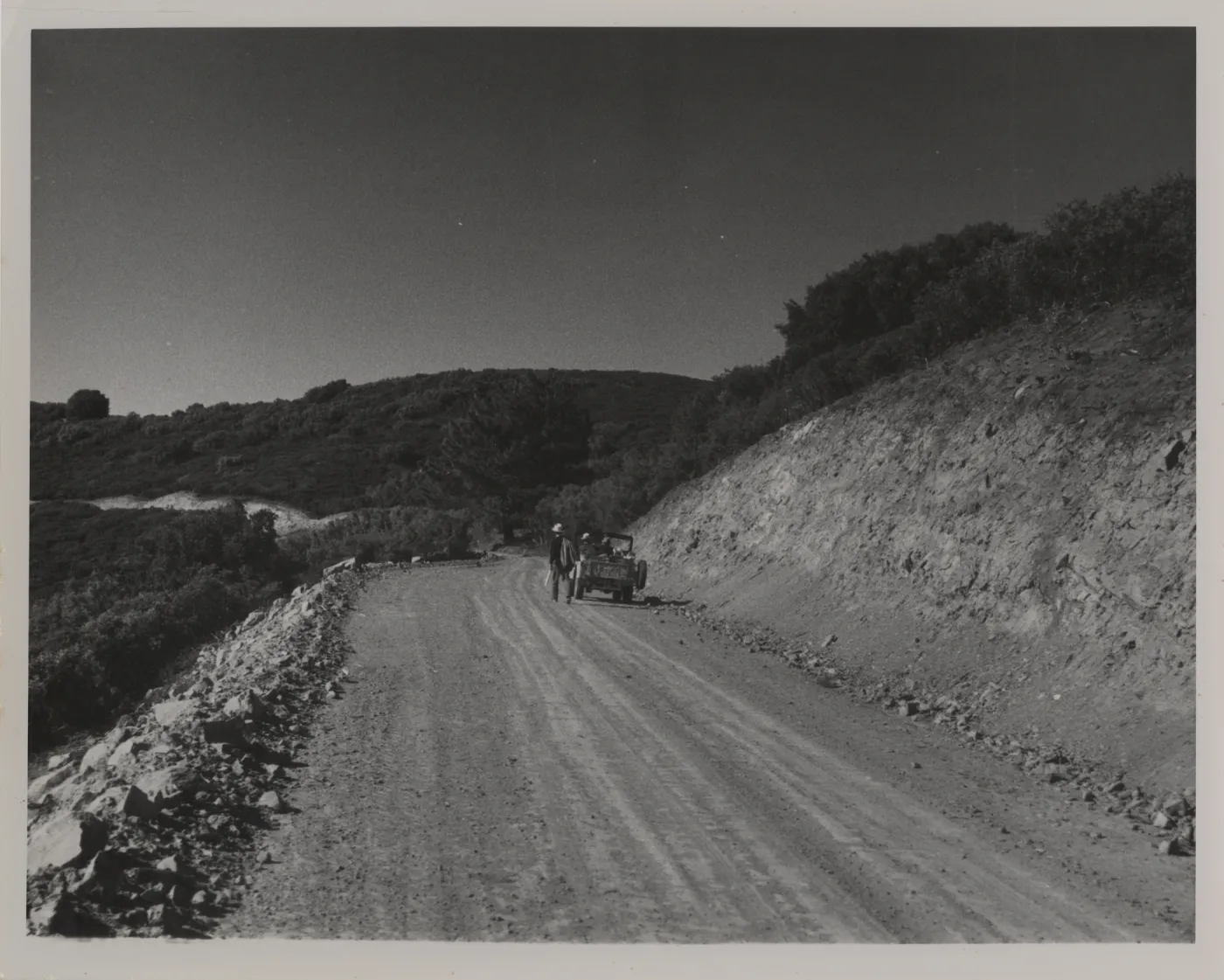 Sierra Madre Road soon after construction, jeep with field researchers