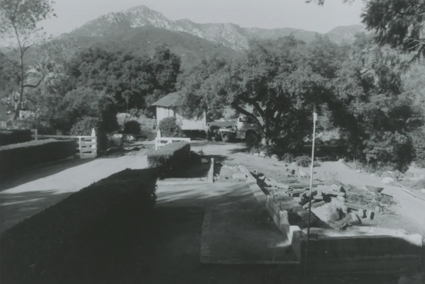 site of North Wing construction, moving the Maintenance Shed (to east side of the Gane House)